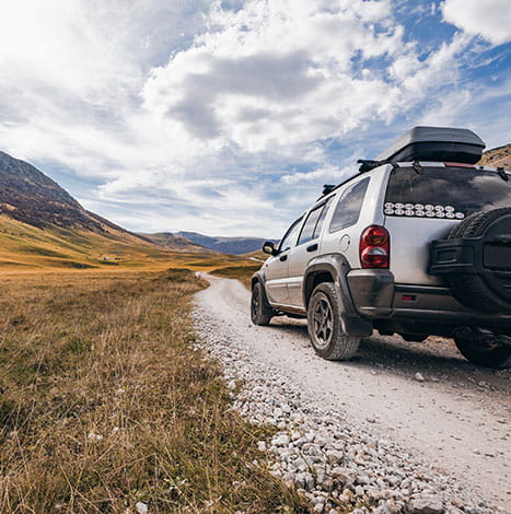 car with mountains ahead