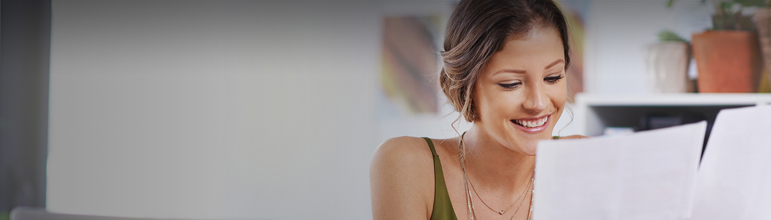 Konica Minolta banner - Lady looking at papers