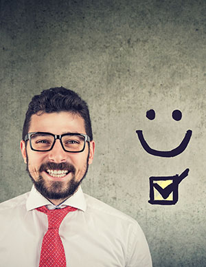 business professional smiling with a happy face next to him