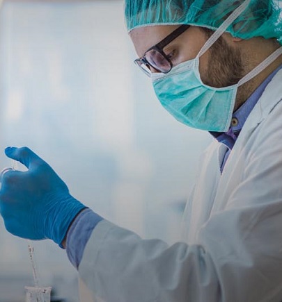 chemist working in lab with mask on