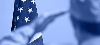 U.S. Army person saluting U.S flag