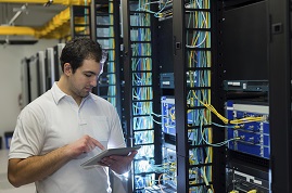 man working in a network lab