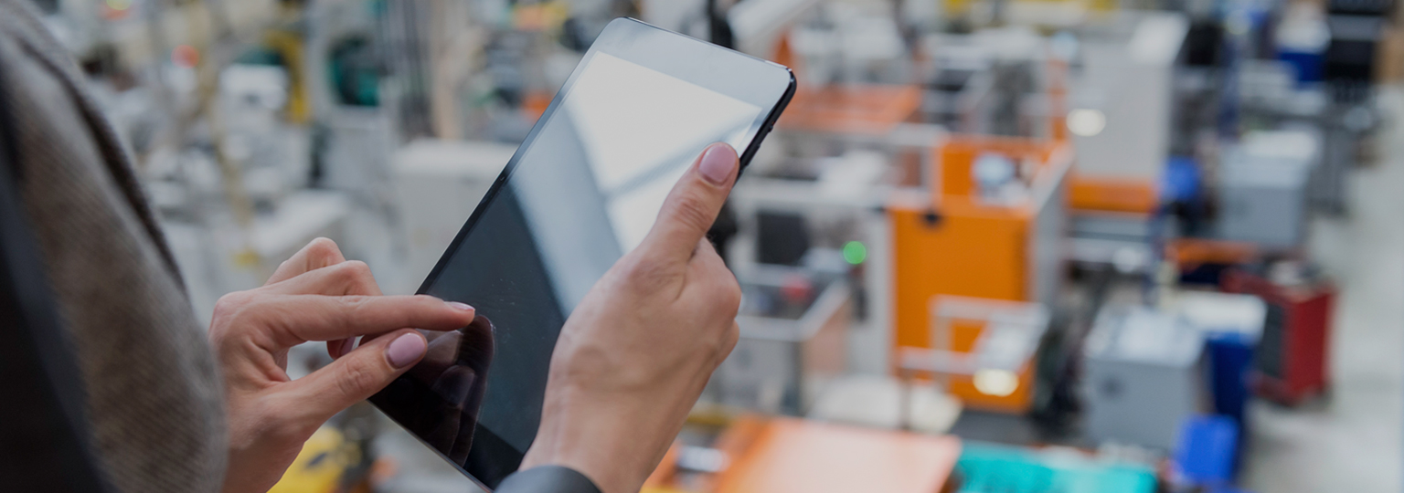 Close up of hands working on a tablet