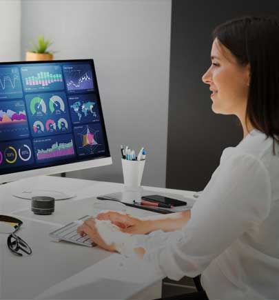 woman working with screens in front of her