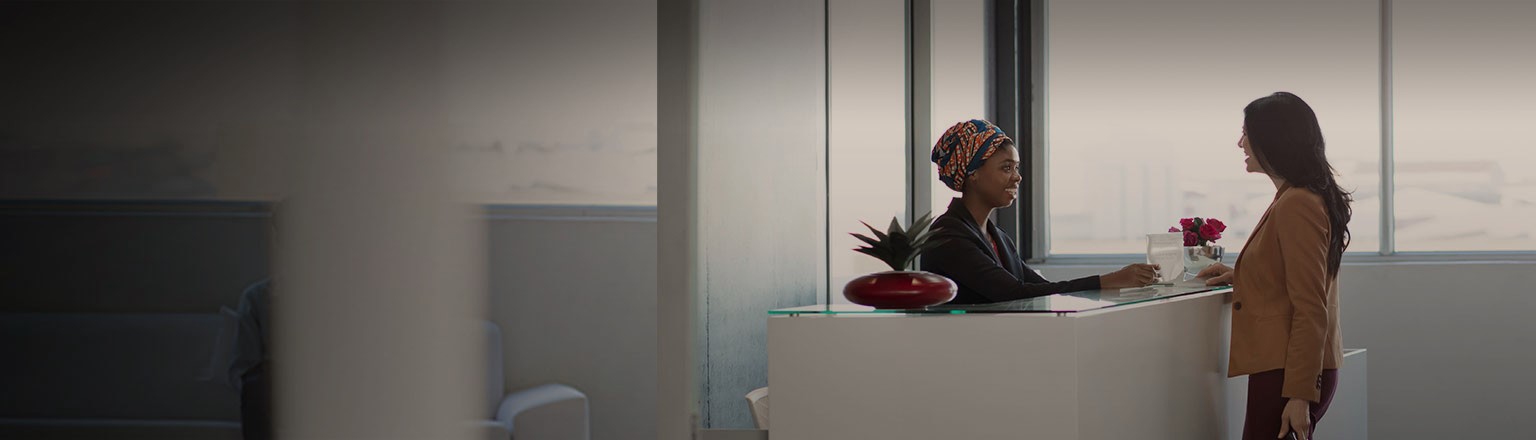 female executive at office reception counter